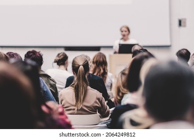 Woman Giving Presentation On Business Conference Event