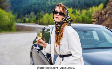 A Woman With A Glass Of Wine Is Waiting For A Sober Driver. Designated Driver Service