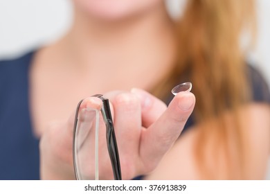 Woman With Glasses And Lens Contact.