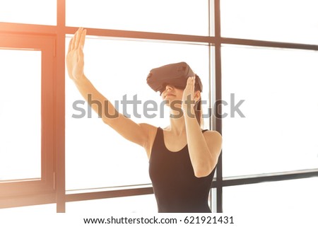 Woman with glasses of virtual reality. Future technology concept. Modern imaging technology.