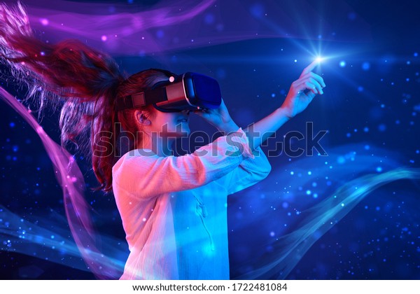 Woman with glasses of virtual\
reality. Future technology concept. Colorful neon\
lights.