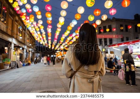 Woman go Dihua street to enjoy New year decoration in Taipei city