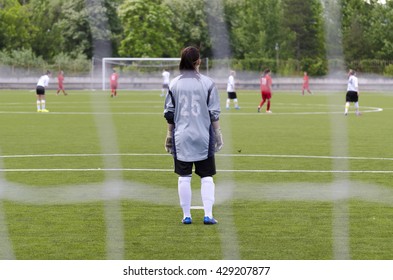 Woman Goalkeeper With Her Back To Goal.