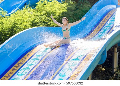 Woman Going Down A Water Slide