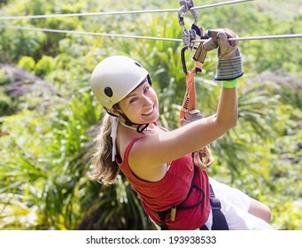 Woman going on a jungle zip line adventure - Shutterstock ID 193938533