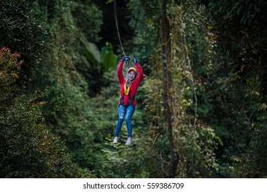 Woman Going On A Jungle Zip Line Adventure, Asia