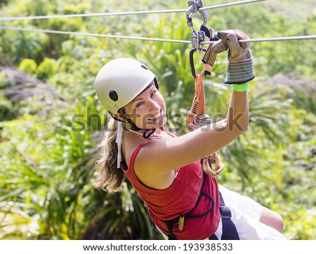 Woman going on a jungle zip line adventure