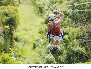 Woman going on a jungle zipline adventure - Powered by Shutterstock