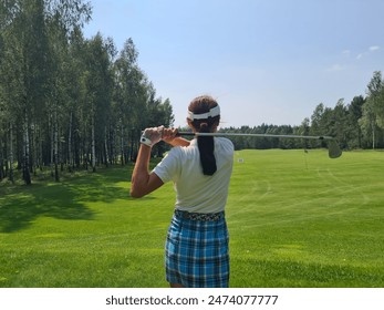 Woman Golfing On A Sunny Summer Day In A Green Field - Powered by Shutterstock