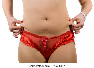 A Woman Is Grabbing Her Love Handles Around Her Waist