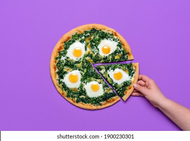 Woman grabbing a slice of pizza. Flat lay, vegetarian pizza with spinach, mozzarella and eggs, isolated on a purple background. Homemade Italian dish - Powered by Shutterstock