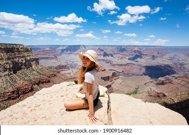 Woman in Grand Canyon National Park. Panoramic picture of Arizona USA from the South Rim