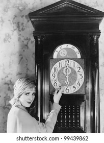 Woman With Grandfather Clock At Midnight