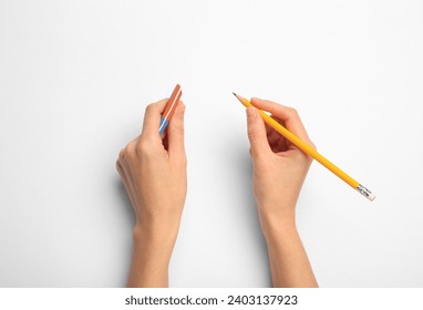 Woman with graphite pencil and eraser on white background, top view - Powered by Shutterstock