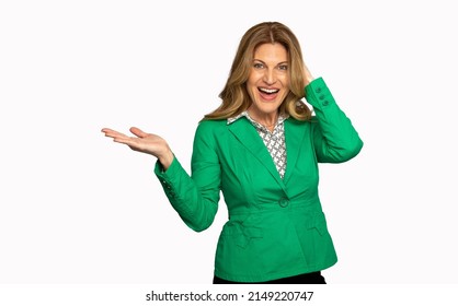 A Woman In A Green Business Suit Smiling And Pointing To Camera Left