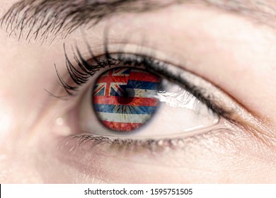 Woman Green Eye In Close Up With The Flag Of Hawai State In Iris, United States Of America 