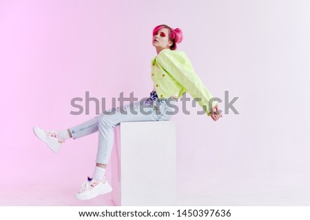 woman in green jacket sitting