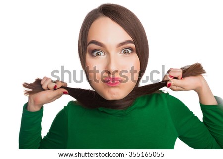 Woman in a green turtleneck showing emotions and feelings