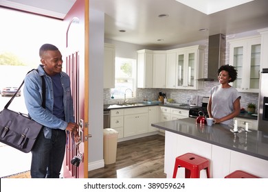 Woman Greeting Man Returning Home From Work