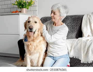 Woman With Grey Hair Enjoys Time At Home With Golden Retriever - Powered by Shutterstock