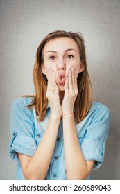woman grimace hands on cheeks. isolated on gray background - Shutterstock ID 260689043