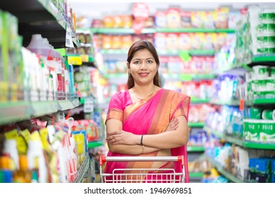 Woman In Grocery Aisle Of Supermarket Stock