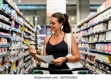 Woman Grocery Shopping, Supermarket Stock Photo