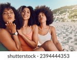 Woman group, beach vacation and lips blow kiss with happiness, sunshine and natural african hair. Happy black woman, friends and ocean sand in portrait pouting, bonding and together on summer holiday