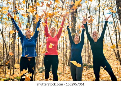 Woman Group Out Running Together In An Autumn Park They Run A Race Or Train In A Healthy Outdoors Lifestyle Concept