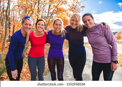 Woman Group Out Running Together In An Autumn Park They Run A Race Or Train In A Healthy Outdoors Lifestyle Concept