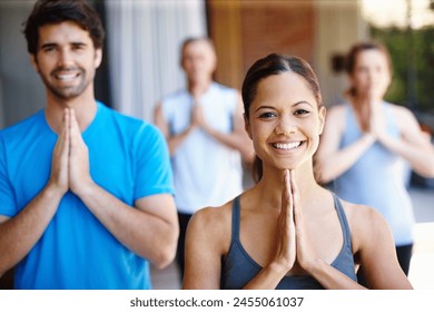 Woman, group and yoga class for workout, portrait and wellness for health and smile. People, fitness and stretch for peace, eagle pose and balance with instructor for holistic energy for home pilates - Powered by Shutterstock