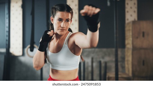 Woman, gym and boxing with training, wrapping and practice for match and sports with endurance. Challenge, fighter or boxer with workout or girl in wellness centre or progress with health and fitness - Powered by Shutterstock