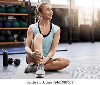 Woman, gym and exercise relax on floor for training break or fitness recovery, thinking or self care. Female person, athlete and sports wellness for health performance or workout, progress or resting - Powered by Shutterstock