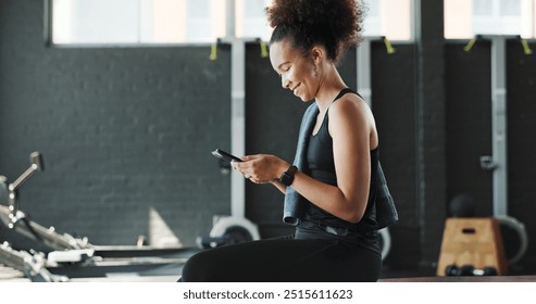 Woman, gym and happy with smartphone on rower machine for social media post and interaction. Female person, sports center and fitness with smile or laugh on internet for funny videos and memes - Powered by Shutterstock