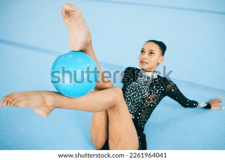 Woman, gymnastics and feet with performance ball in training, exercise or fitness practice for competition, flexibility or dynamic art. Rhythmic gymnast, athlete or equipment for dance sports workout