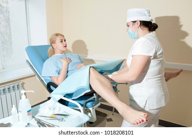 Woman at the gynecologist - Shutterstock ID 1018208101