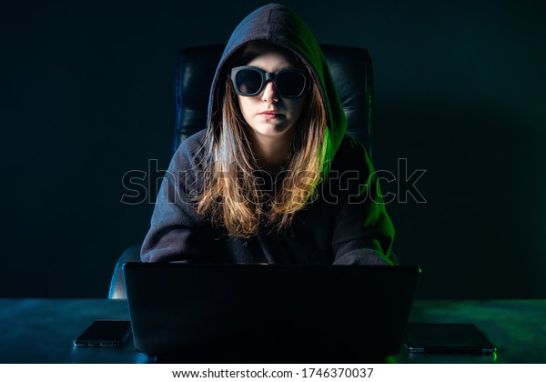 woman-hacker-girl-works-laptop-600w-1746370037.jpg