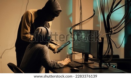 Woman hacker using her knowledge of computer systems to access information and steal passwords. Criminal breaking security firewall for espionage, hacktivism cryptojacking. Handheld shot.