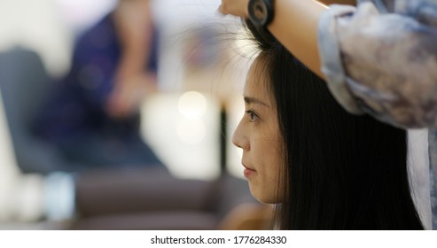 Woman with hair cut at salon - Shutterstock ID 1776284330
