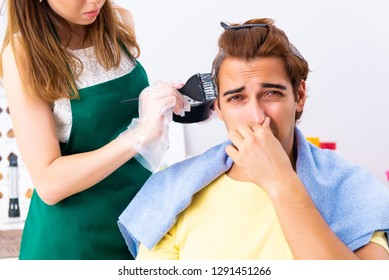 Woman Hairdresser Applying Dye To Man Hair