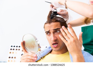 Woman Hairdresser Applying Dye To Man Hair