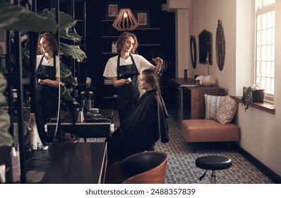 Woman, hairdresser and blow hair of customer for treatment, haircare and professional for hairstyle. Beauty salon, cosmetologist and hairstylist with equipment for grooming client, service and care. - Powered by Shutterstock