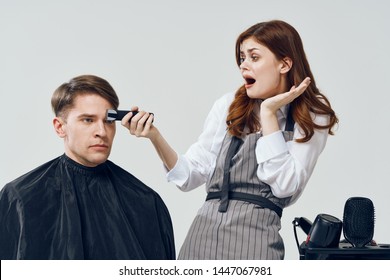 Woman Hairdresser Does A Haircut To A Man. Fashion Hair Salon Style Man