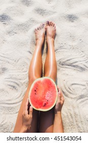 Woman With Half Of Watermelon On Beach