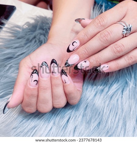 Woman with Halloween spider nails design. Manicure. Nail salon. Scary Nail. Halloween Nail. Spider