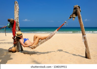 Woman In Hammock On Tropical Beach At Tioman Island, Malaysia