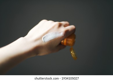 Woman Hand Applying Sunscreen Cream 