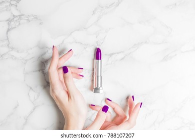 Woman Hand With Beautiful Purple Ultra Violet Nail Lipstick Cosmetic Minimal Modern Stylish