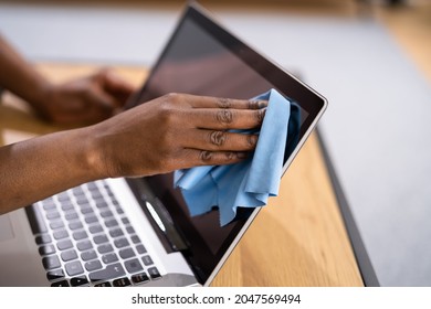 Woman Hand Cleaning Laptop Screen With Laptop At Home - Powered by Shutterstock