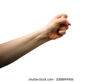 Woman Hand With Clenched Fist Raised Forward In Protesting Gesture. Concept Of Feminist Movement And Struggle For Rights. Female Hand With Manicured Nails In Powerful Gesture As Symbol Of Woman Power